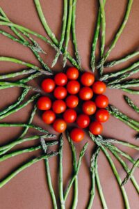 Article: Asparagus Companion Planting. Asparagus wheel with tomatoes in the centre