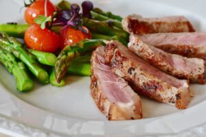 Article: Asparagus Companion Planting. Asparagus with tomatoes and rare steak