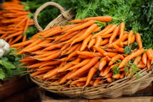 Article: Companion Plants for Carrots. Carrots in a basket