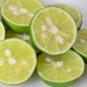 Article: Growing Citrus trees.. Pic - Sliced sudachi limes showing vivid green flesh and seeds.
